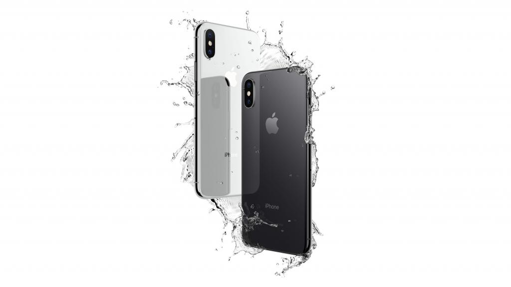 在水滴的稀薄的智能手机iphone X在白色背景的 高清图片 壁纸 酷酷桌面