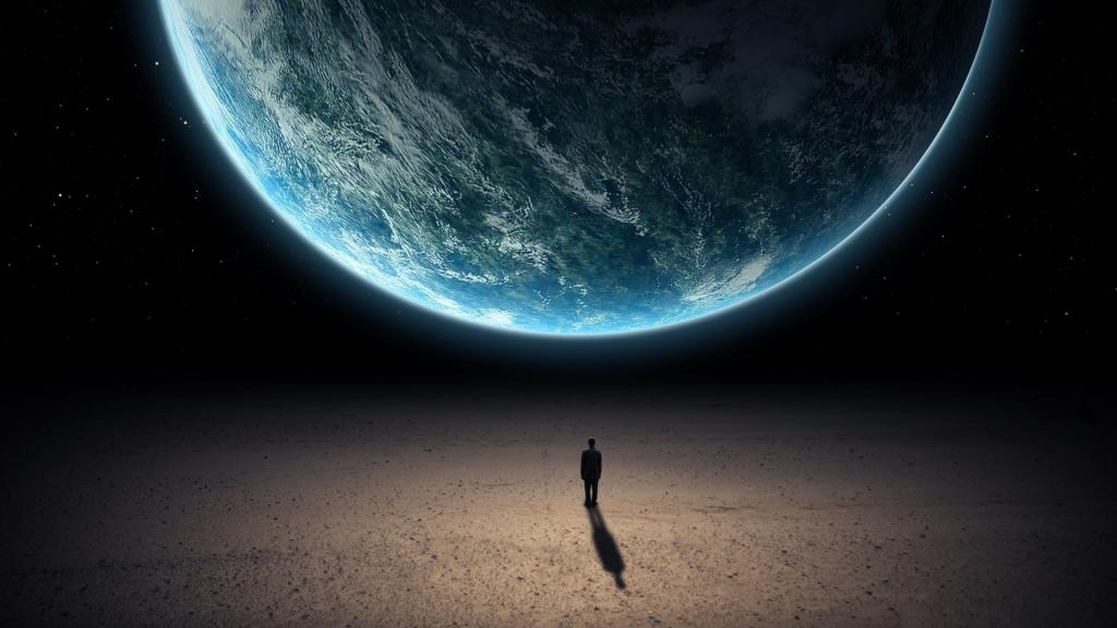 男人站在地球的前面