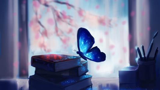 蓝色的魔法蝴蝶坐在书上