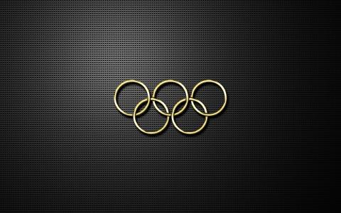 在黑色背景上的金色奥运五环