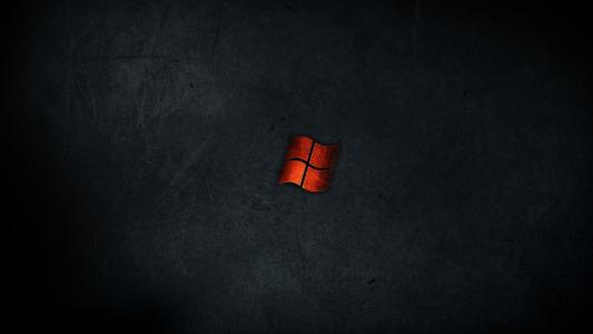 微软Windows的橙色旗子在黑背景的