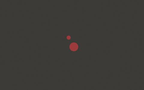 两个红色的小圆点，黑色背景