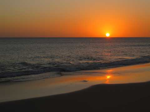沙滩残阳夕阳景观图片