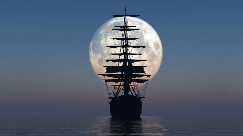 一艘帆船在月亮的背景中的剪影